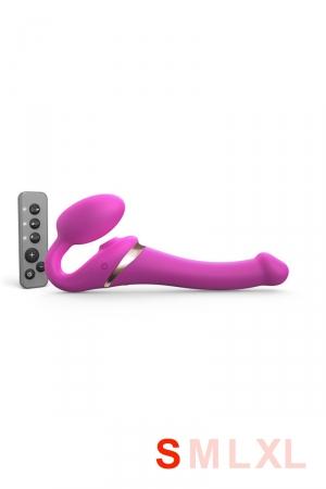 Nouvelle édition du gode-ceinture anatomique  Strap-On-Me vibrant,  doté d'une langue vibrante pour le clitoris. fuchsia, taille S.