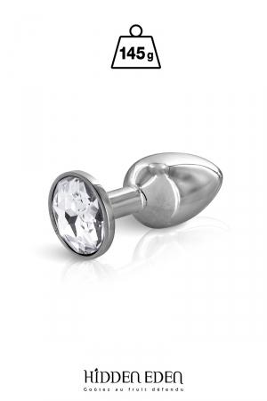 Plug anal en acier dune longueur de 7,5 cm et dun diamètre moyen de 2,8 cm. Décoré dun strass rond transparent.