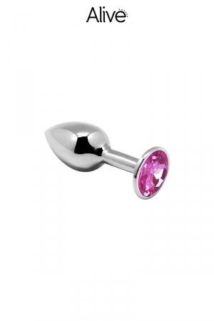 Plug anal en métal dune longueur de 6,3 cm et un diamètre de 2,8 cm décoré d'un strass rose.