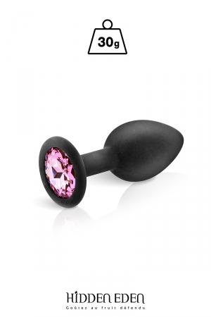 Plug anal en silicone noir dune longueur de 7,2 cm et dun diamètre moyen de 2,7 cm. Décoré dun strass rond rose.