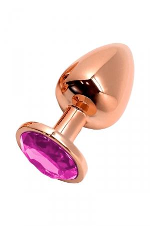 Plug anal en métal couleur rose gold dune longueur de 8 cm et dun diamètre de 3,4 cm, décoré dun bijou rose à sa base.